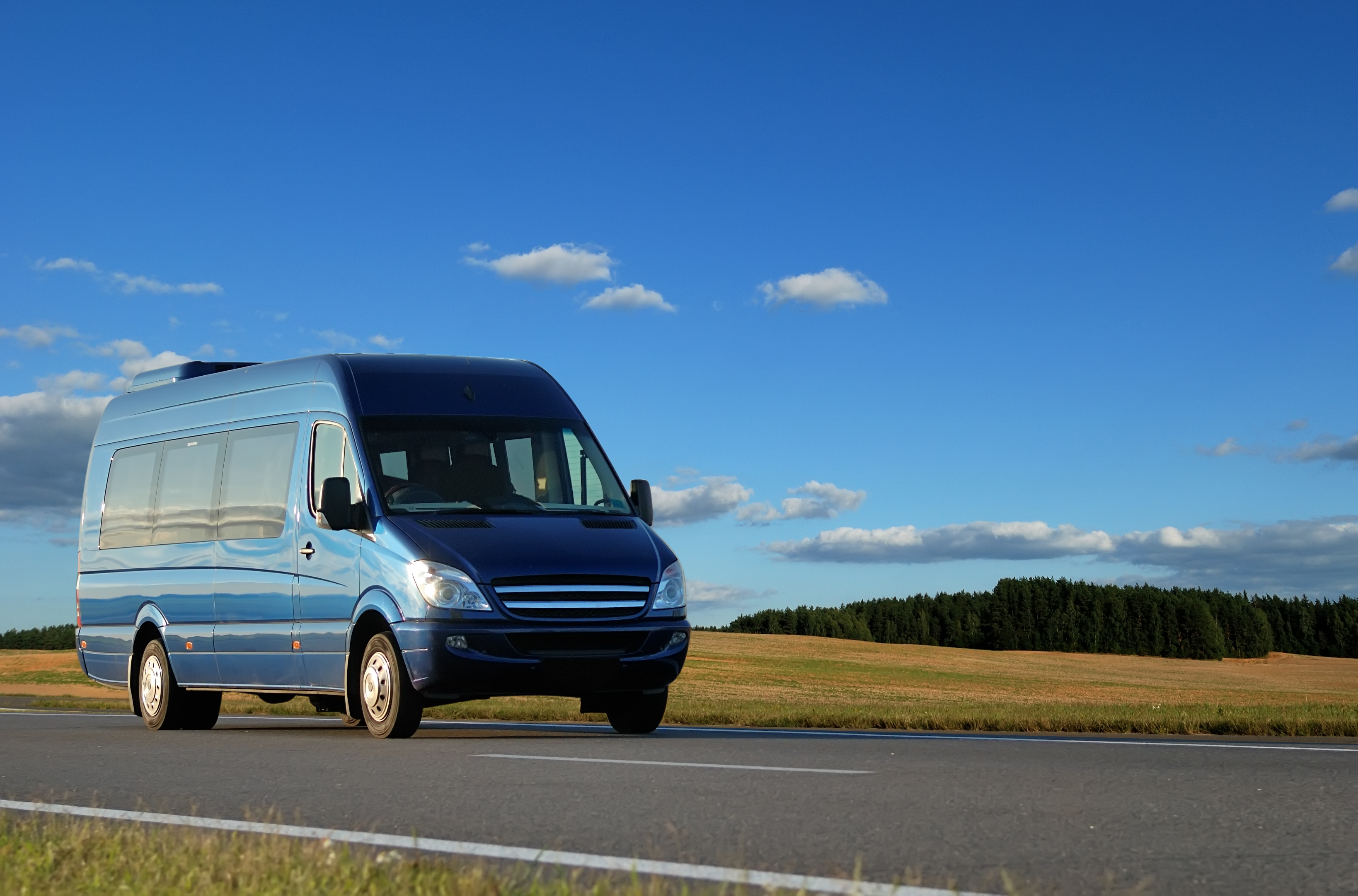 bigstock-Blue-Minibus-On-Highway-5706004